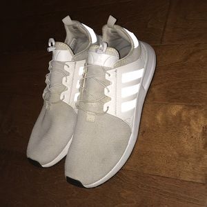 Men’s white adidas athletic shoes